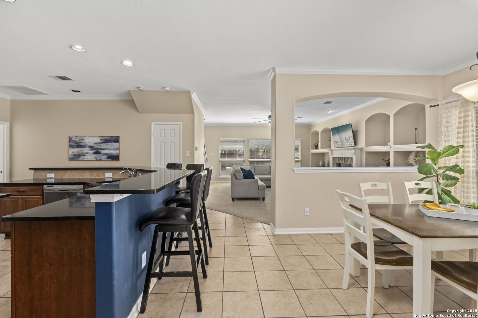 16106 Ponderosa Pth Helotes, TX 78023 - Photo 8 of 40 a view of a dining room with furniture and a potted plant
