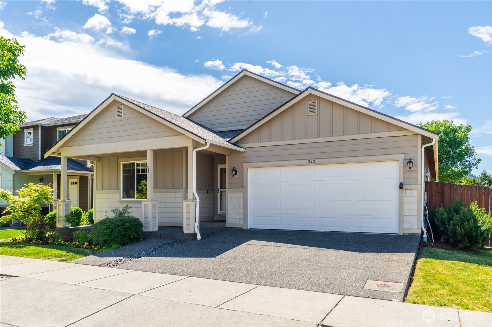 242 Riggs Drive East Enumclaw, WA 98022 - Photo 2 of 40 a view of house with garden and garage