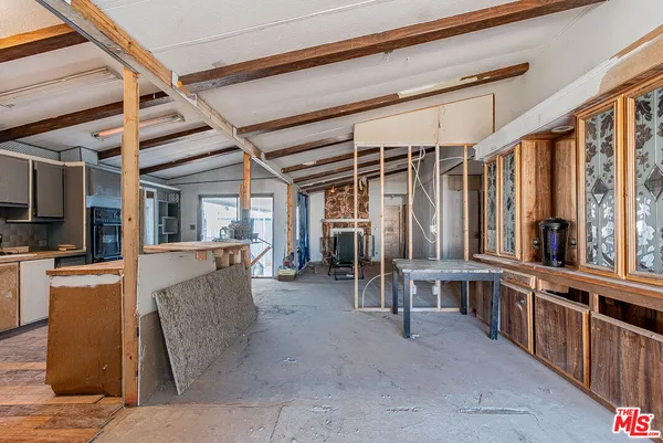 a kitchen with sink cabinets and stove