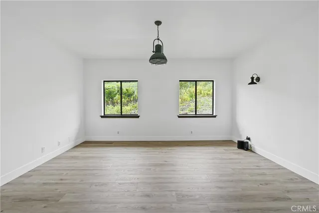 an empty room with windows and windows