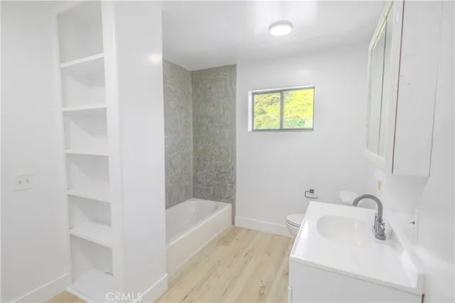 a bathroom with a sink and a bathtub
