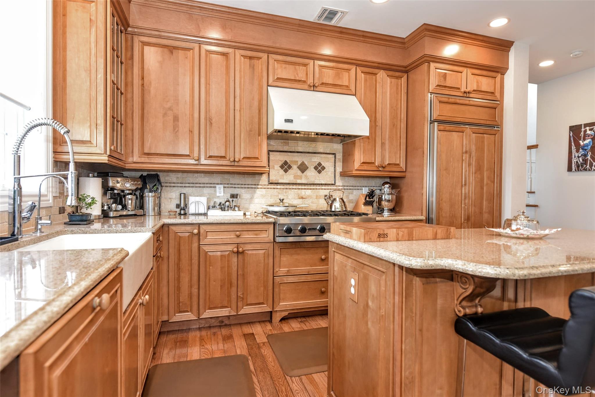 46 Mansion Ridge Boulevard Monroe, NY 10950 - Photo 16 of 46 Kitchen featuring wood-finish cabinetry, granite countertops, an undermount farmhouse sink, stainless steel appliances, and wood-finish flooring