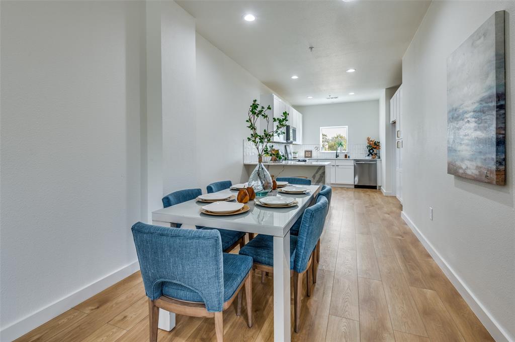 520 South O Connor Road Irving, TX 75060 - Photo 11 of 29 a view of a dining room with furniture and wooden floor
