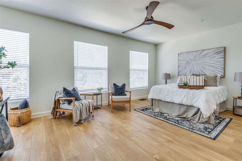 520 South O Connor Road Irving, TX 75060 - Photo 16 of 29 a bedroom with a bed a couch and large window