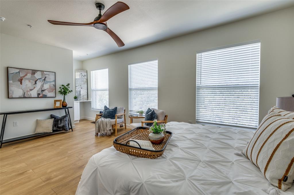 520 South O Connor Road Irving, TX 75060 - Photo 17 of 29 a spacious bedroom with a bed a couch and a window