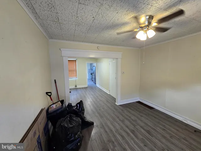 a view of a room with wooden floor and closet