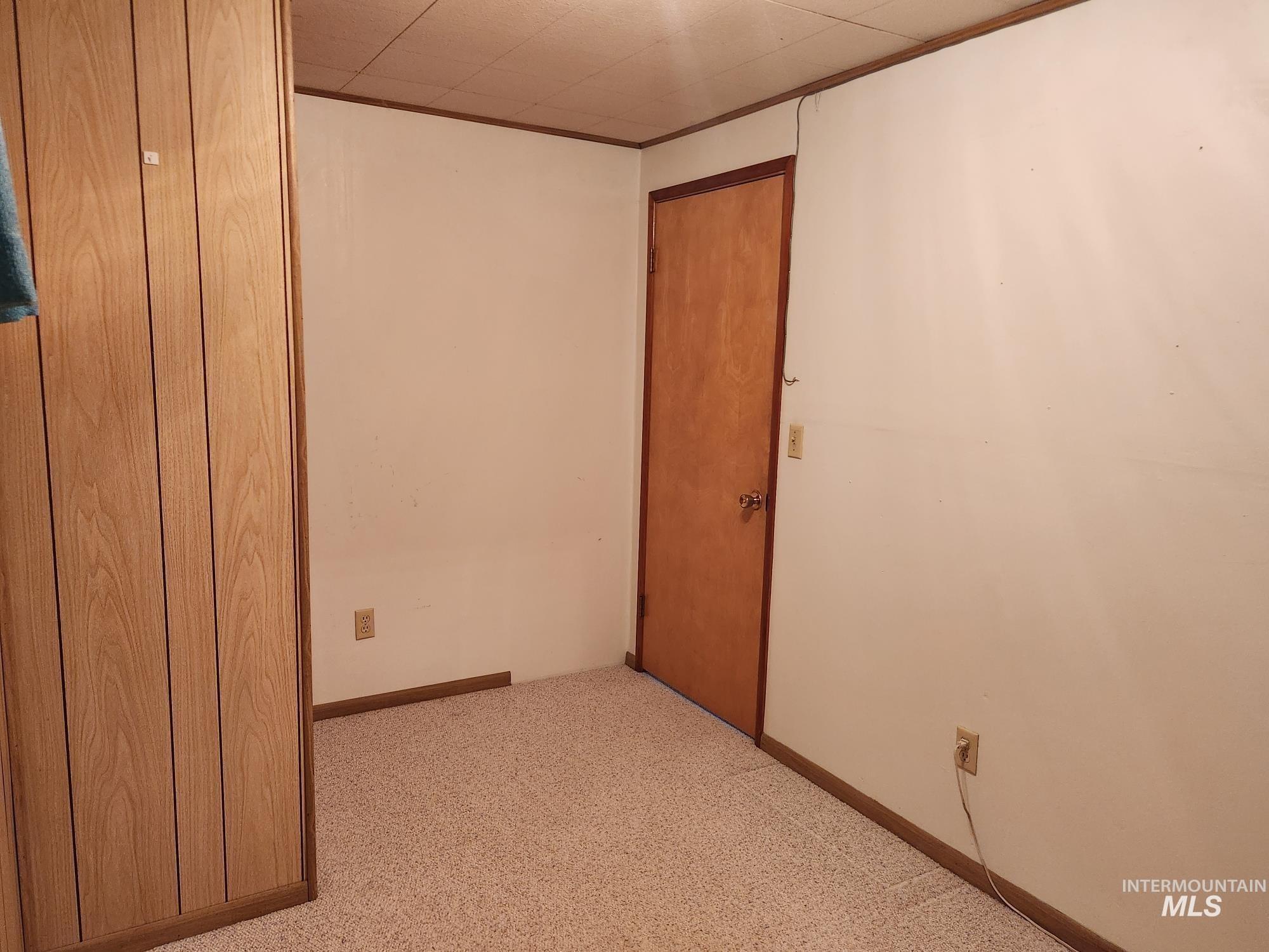 367 Woodland Road Kamiah, ID 83536 - Photo 24 of 45 Spare room featuring light colored carpet and baseboards