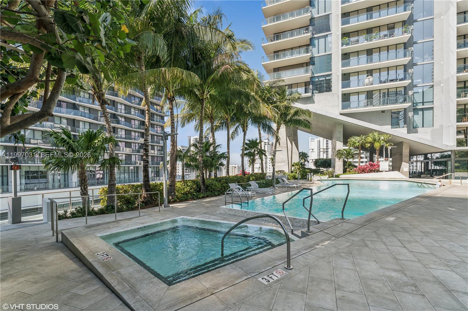 88 Southwest 7th Street, Unit 1804 Miami, FL 33130 - Photo 14 of 39 a view of a swimming pool with a patio