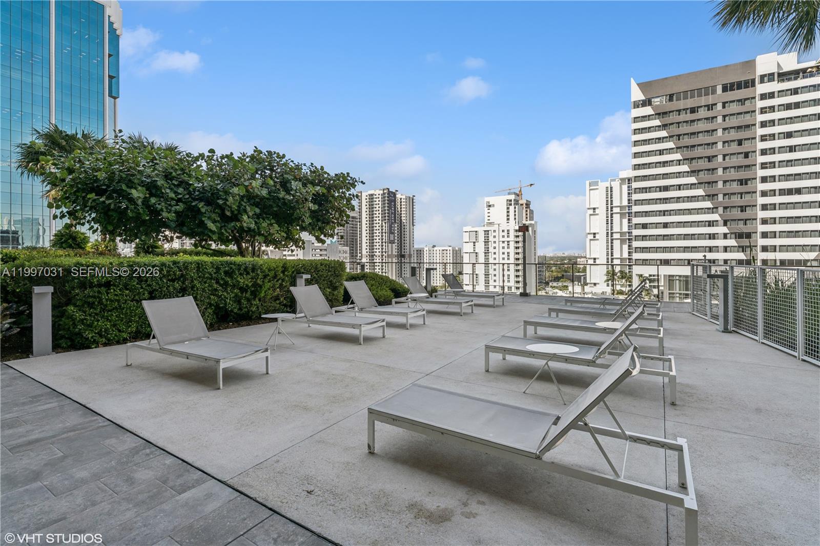 88 Southwest 7th Street, Unit 1804 Miami, FL 33130 - Photo 17 of 39 a view of a patio with a chairs and table in patio