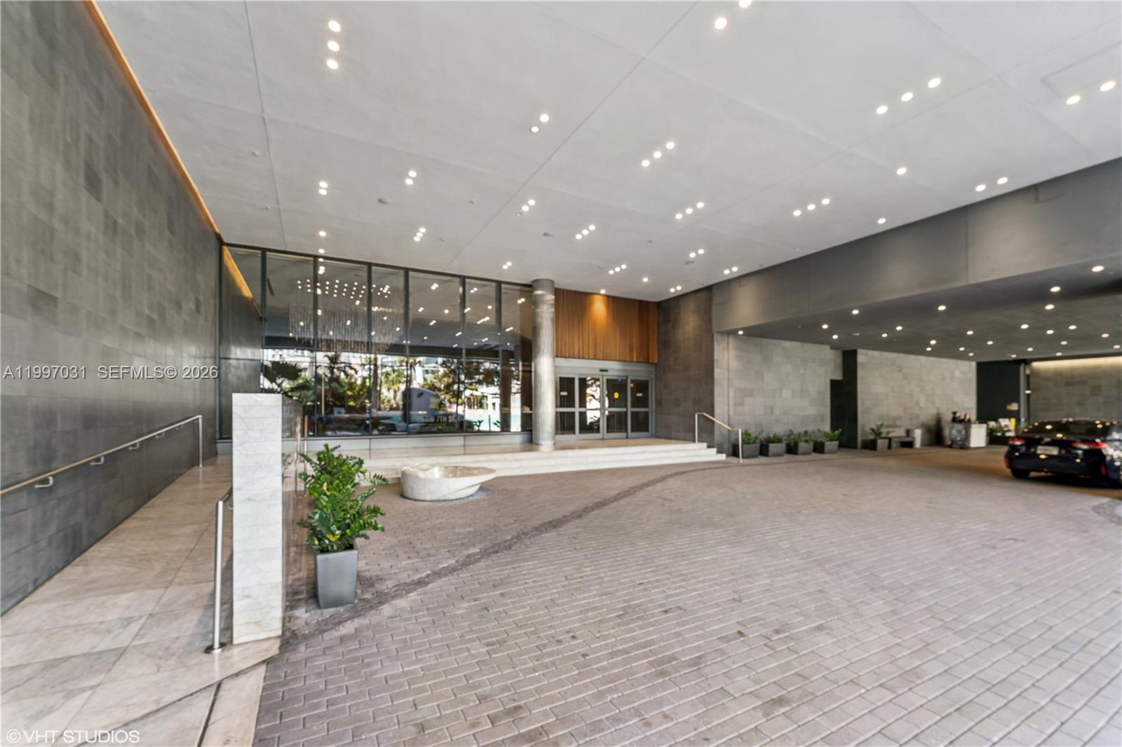 88 Southwest 7th Street, Unit 1804 Miami, FL 33130 - Photo 2 of 39 a view of a hallway with dining area
