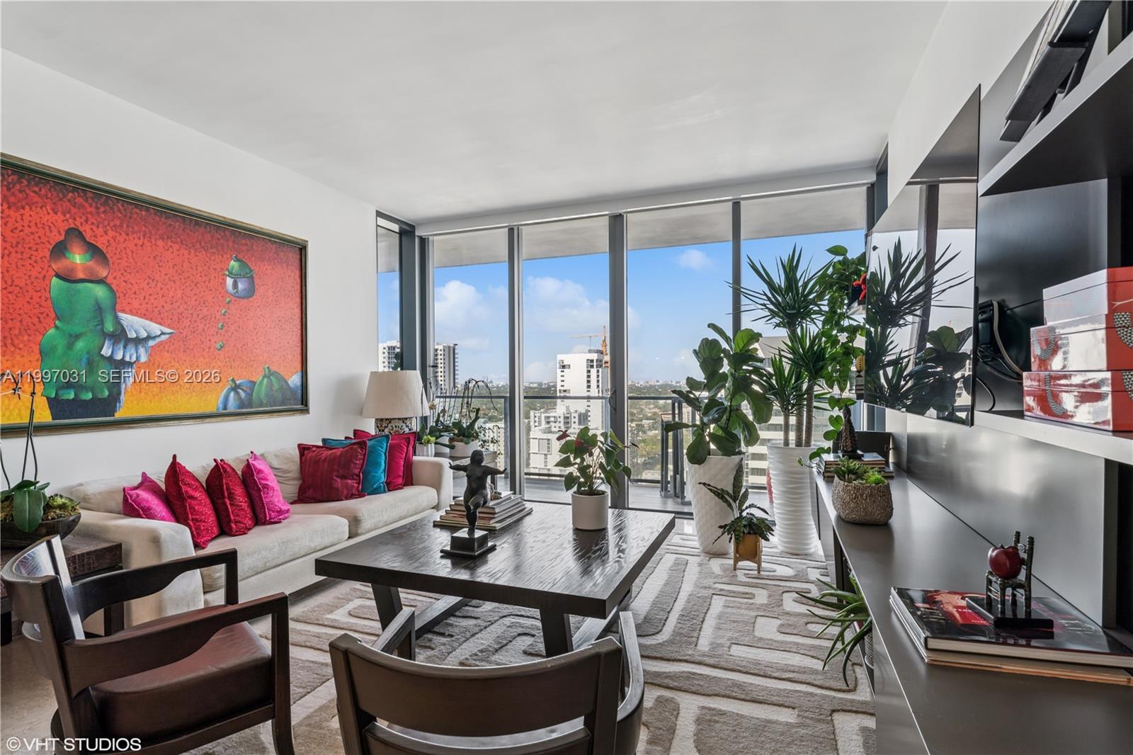 88 Southwest 7th Street, Unit 1804 Miami, FL 33130 - Photo 21 of 39 a dining room with furniture and a potted plant