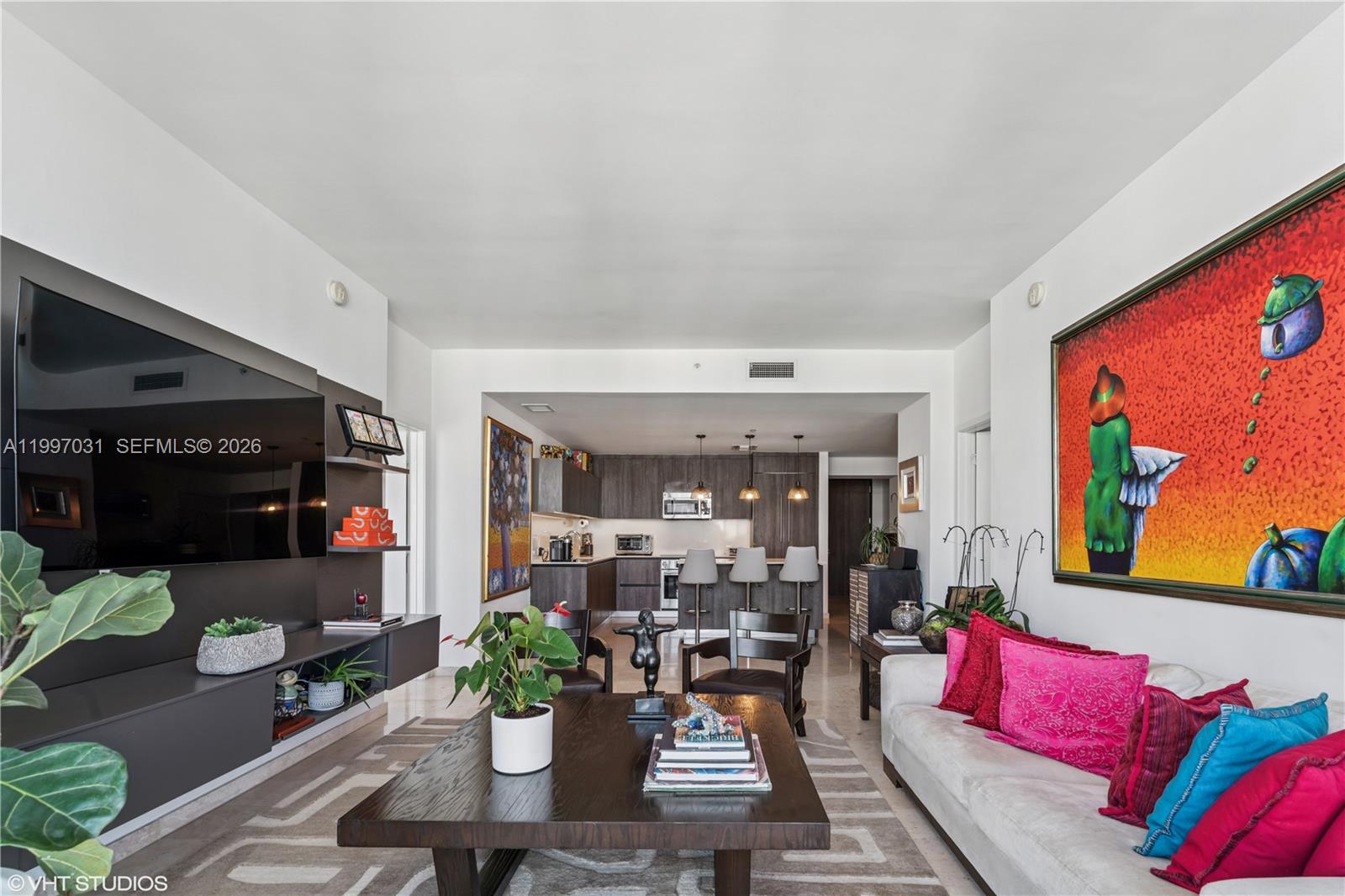 88 Southwest 7th Street, Unit 1804 Miami, FL 33130 - Photo 26 of 39 a living room with furniture kitchen view and a potted plant