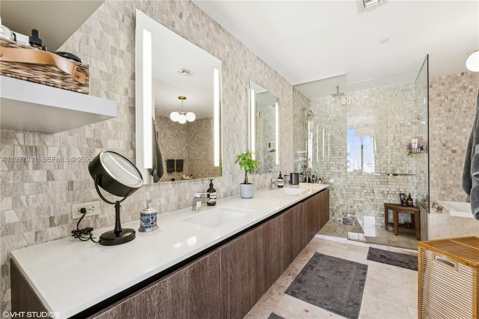 88 Southwest 7th Street, Unit 1804 Miami, FL 33130 - Photo 28 of 39 a bathroom with a sink double vanity and a mirror