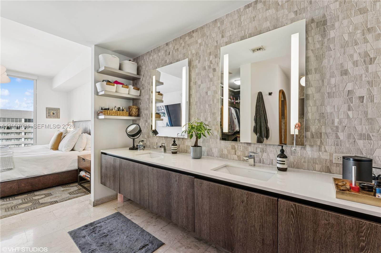 88 Southwest 7th Street, Unit 1804 Miami, FL 33130 - Photo 30 of 39 a en suite bathroom with a double vanity sink and a mirror