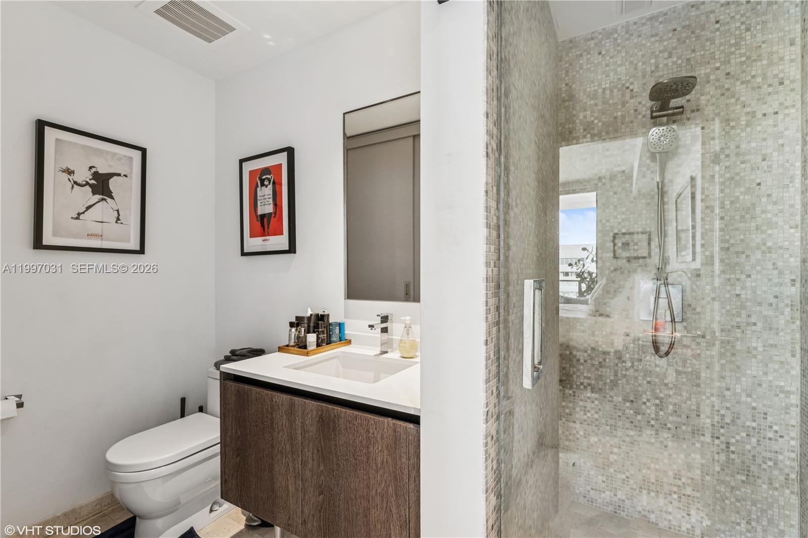 88 Southwest 7th Street, Unit 1804 Miami, FL 33130 - Photo 36 of 39 a bathroom with a sink and a toilet