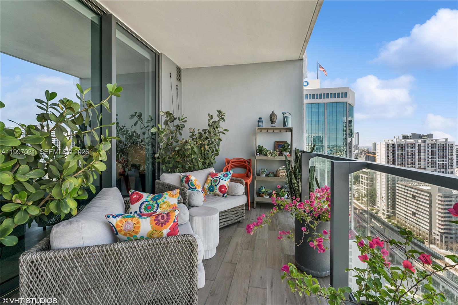 88 Southwest 7th Street, Unit 1804 Miami, FL 33130 - Photo 38 of 39 a outdoor dining space with furniture and garden