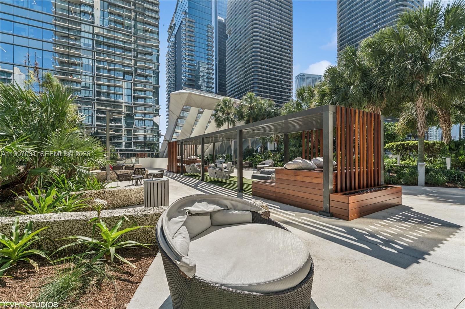 88 Southwest 7th Street, Unit 1804 Miami, FL 33130 - Photo 9 of 39 a view of a swimming pool with a patio