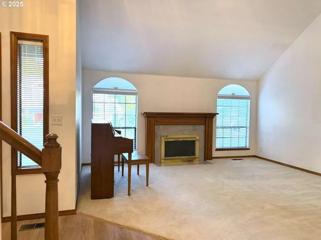 a view of a livingroom with furniture and a fireplace