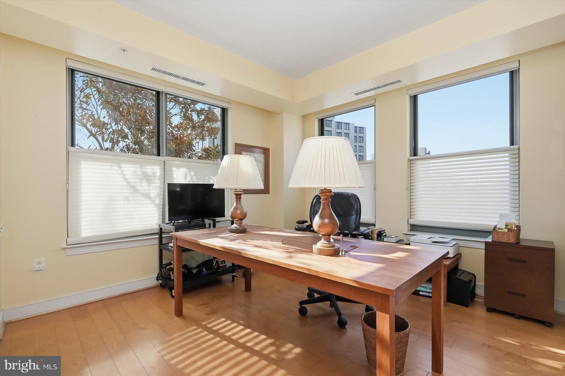 2425 L Street Northwest, Unit 303 Washington, DC 20037 - Photo 20 of 37 a view of a workspace with furniture and a window