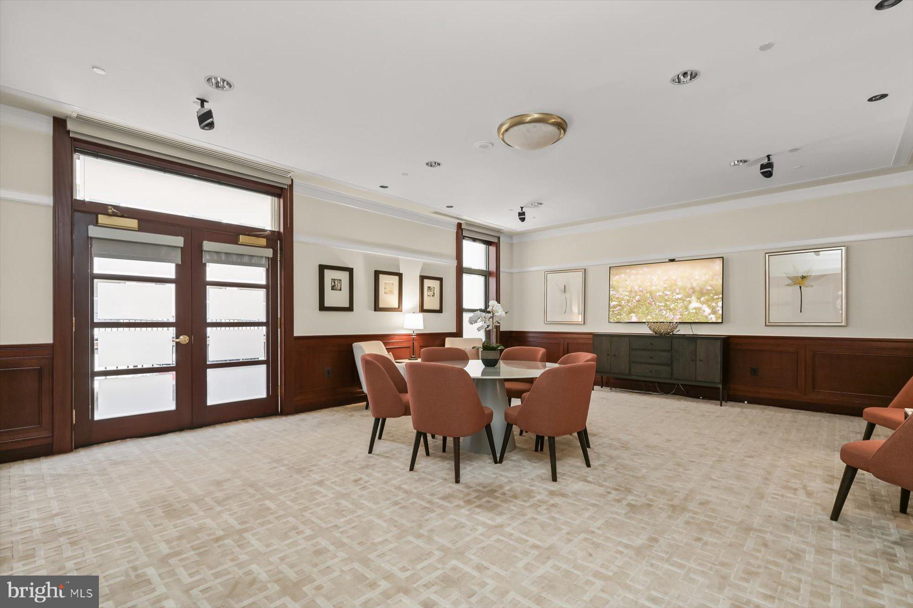 2425 L Street Northwest, Unit 303 Washington, DC 20037 - Photo 35 of 37 a dining room with furniture and windows