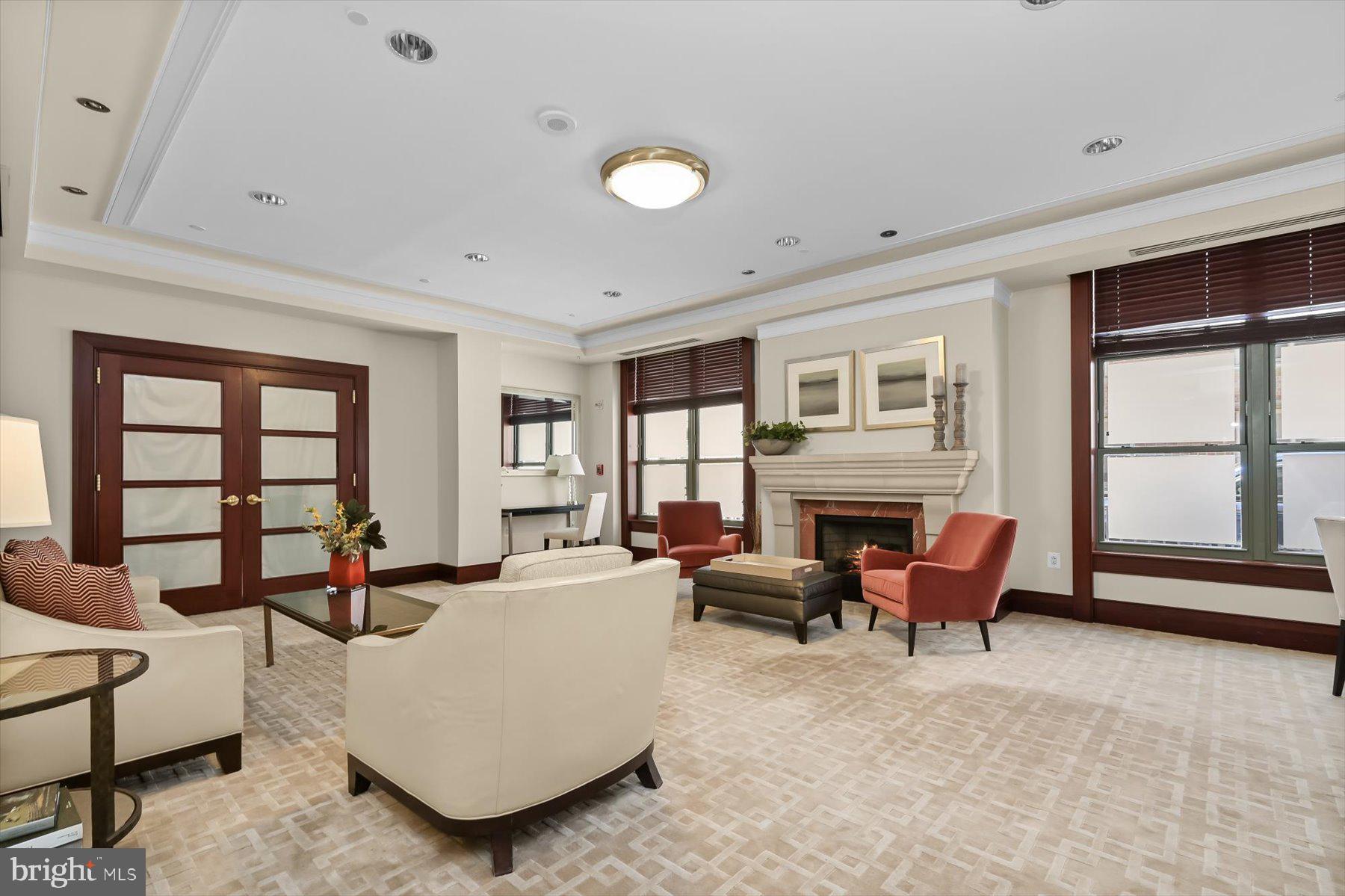 2425 L Street Northwest, Unit 303 Washington, DC 20037 - Photo 37 of 37 a living room with furniture and a flat screen tv