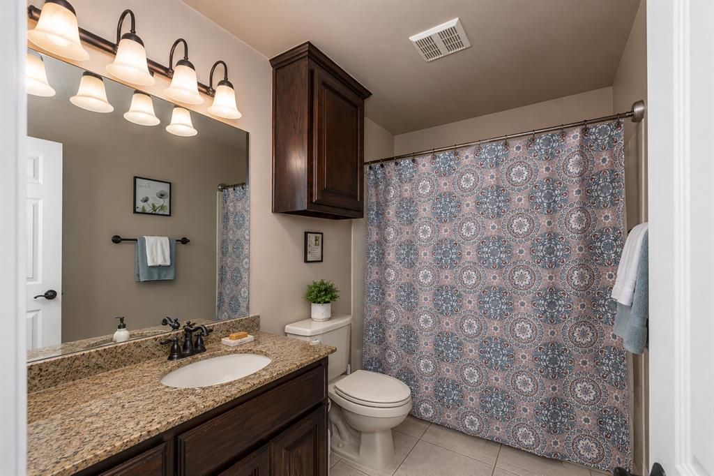 100 Manders Court Runaway Bay, TX 76426 - Photo 28 of 33 a bathroom with a granite countertop sink and a mirror