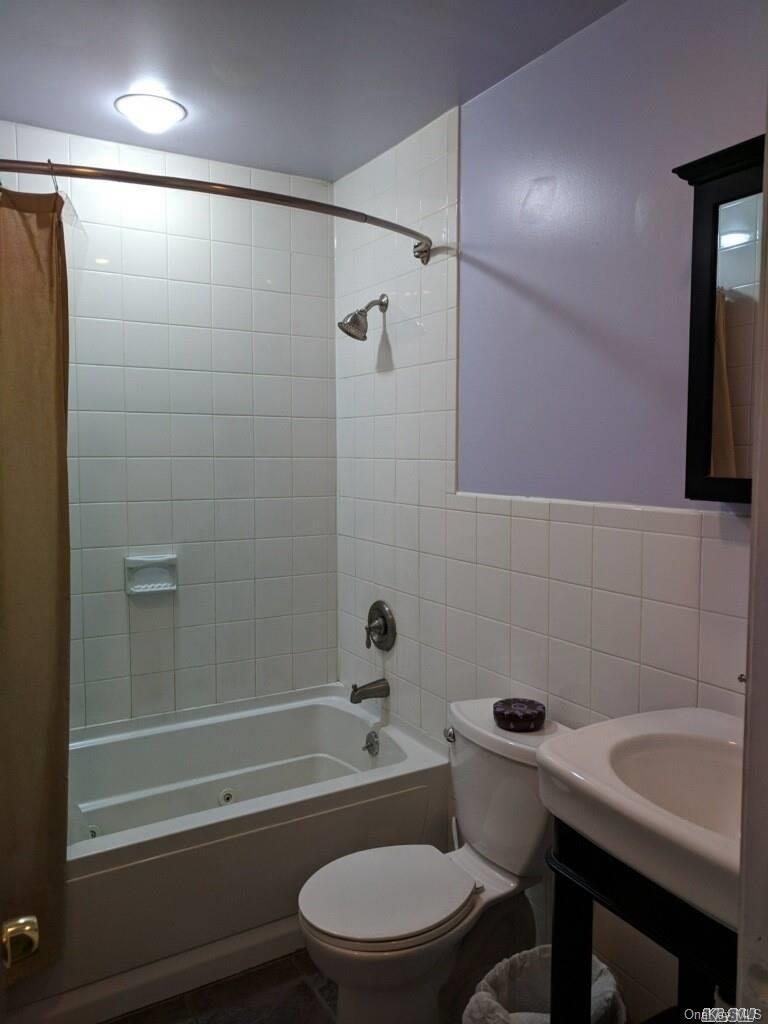 258-16 149th Road Queens, NY 11422 - Photo 11 of 11 a bathroom with a sink a toilet and shower