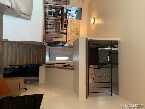 258-16 149th Road Queens, NY 11422 - Photo 8 of 11 a kitchen with appliances and cabinets