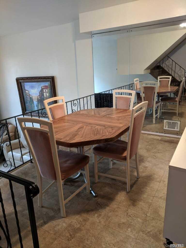 258-16 149th Road Queens, NY 11422 - Photo 9 of 11 a dining room with furniture and window