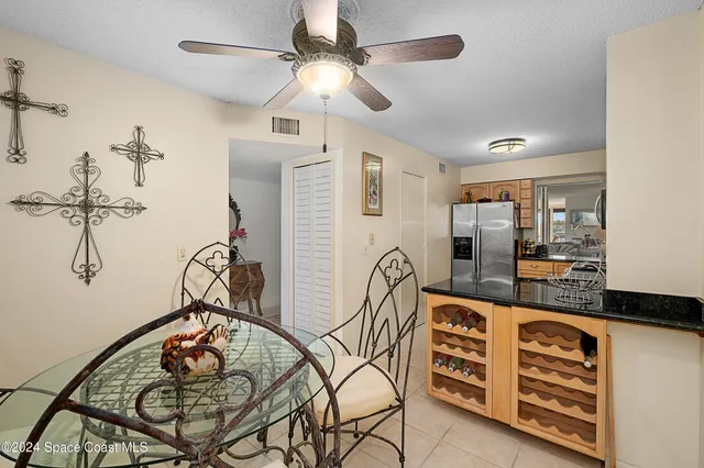 a very nice looking dining room with a table and chandelier