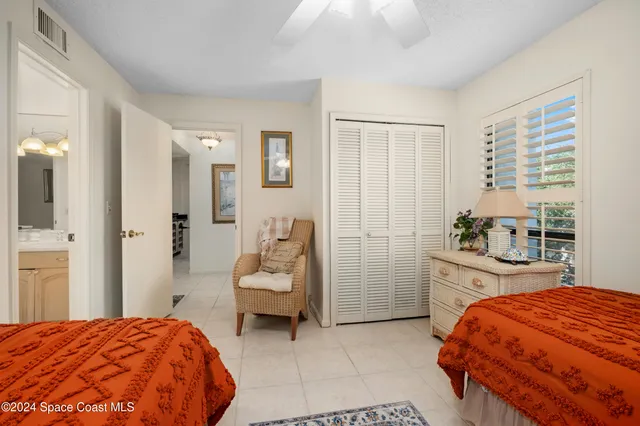 a bedroom with a bed and a cabinets