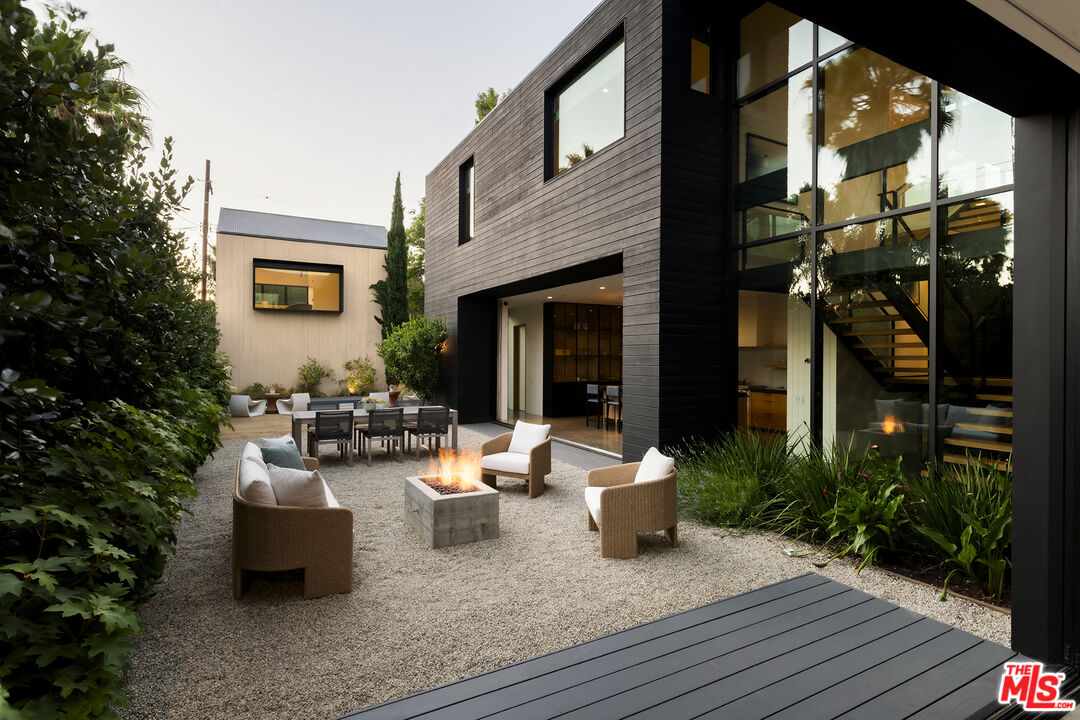 901 Flower Avenue Venice, CA 90291 - Photo 30 of 35 a view of a patio with couches table and chairs and potted plants
