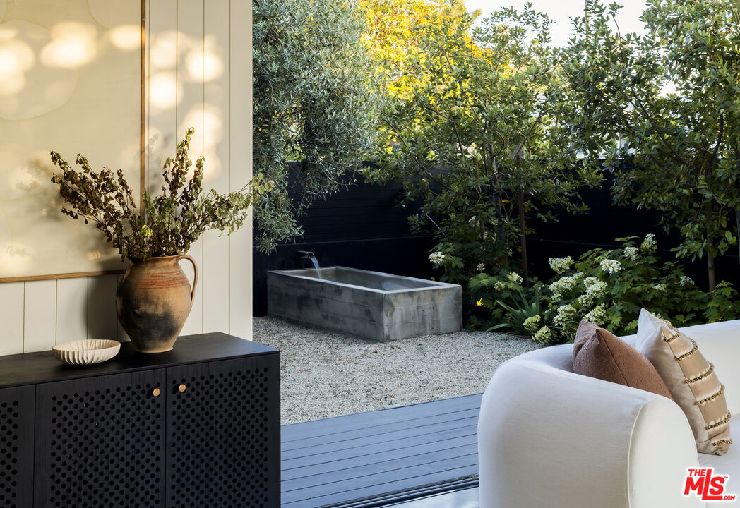 901 Flower Avenue Venice, CA 90291 - Photo 5 of 35 a view of two chairs and a potted plant on a table
