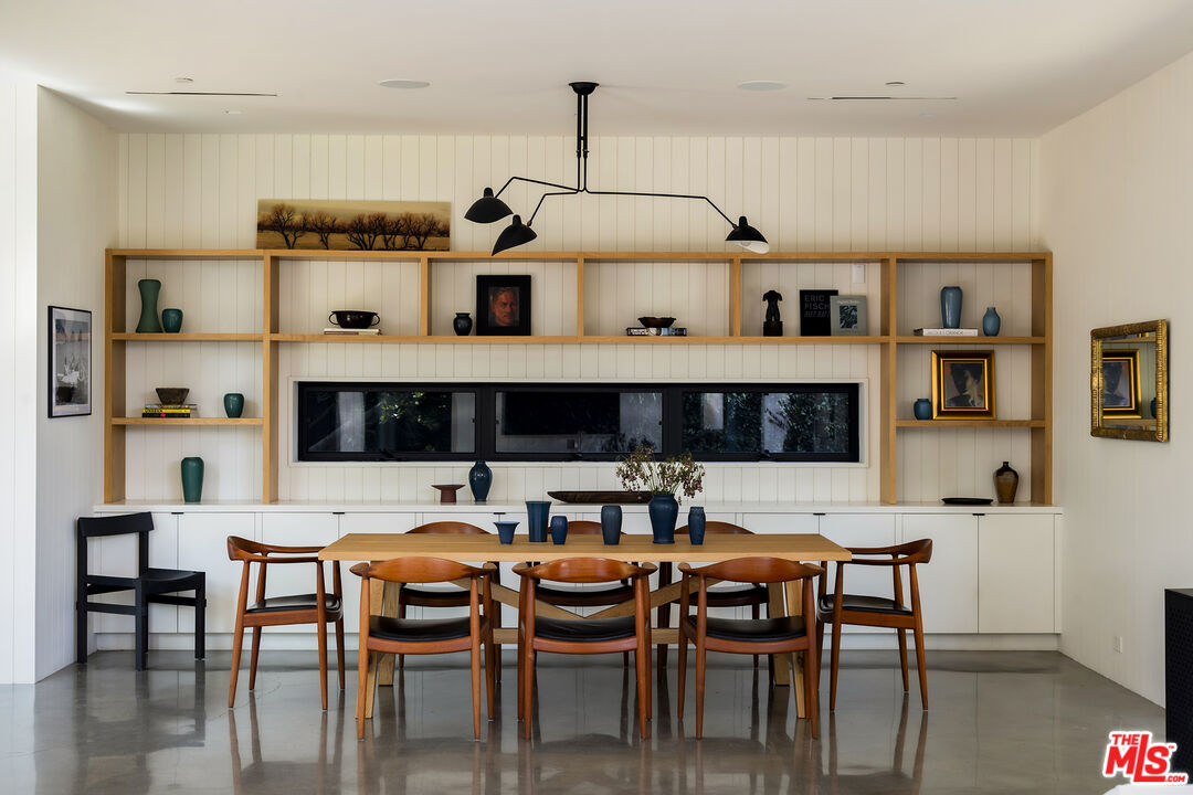 901 Flower Avenue Venice, CA 90291 - Photo 6 of 35 a living room with furniture and a dining table with kitchen appliances