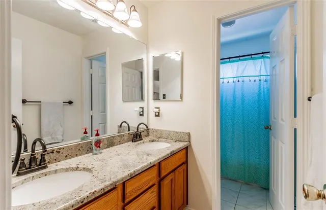 a bathroom with a sink and vanity
