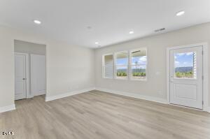 2760 River Meadow Spring Hope, NC 27882 - Photo 19 of 42 an empty room with windows and closet