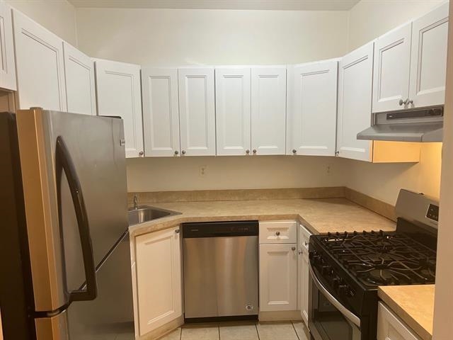 58 Madison Street, Unit 2 Hoboken, NJ 07030 - Photo 13 of 28 a kitchen with stainless steel appliances granite countertop a refrigerator and a stove