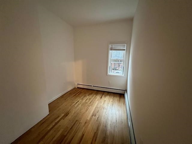 58 Madison Street, Unit 2 Hoboken, NJ 07030 - Photo 16 of 28 wooden floor in an empty room with a window