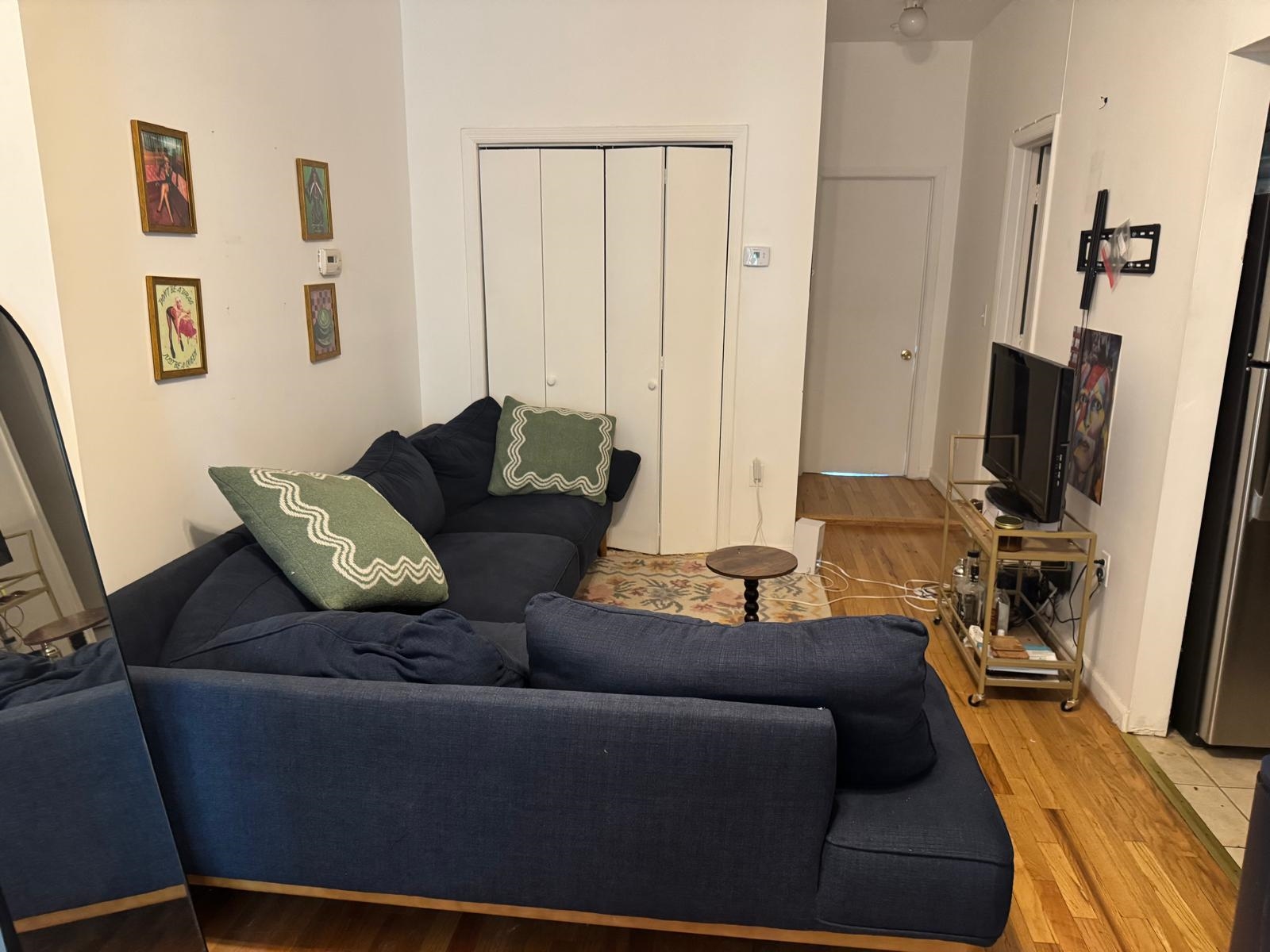58 Madison Street, Unit 2 Hoboken, NJ 07030 - Photo 7 of 28 a living room with furniture and a flat screen tv