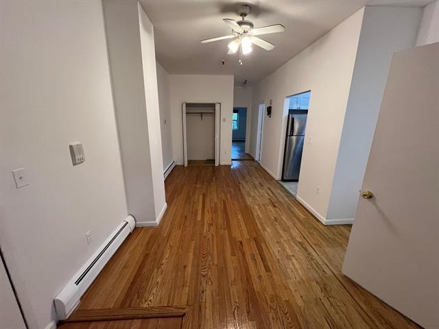 58 Madison Street, Unit 2 Hoboken, NJ 07030 - Photo 8 of 28 a view of a room with wooden floor and staircase