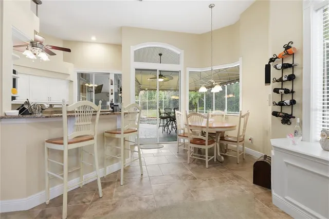 a dining room with furniture and window
