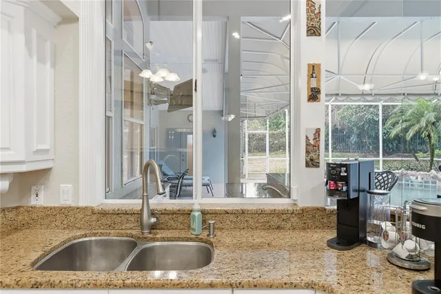 a kitchen with a sink and a window