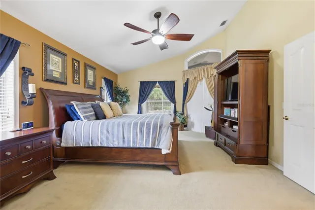 a bedroom with furniture and a window