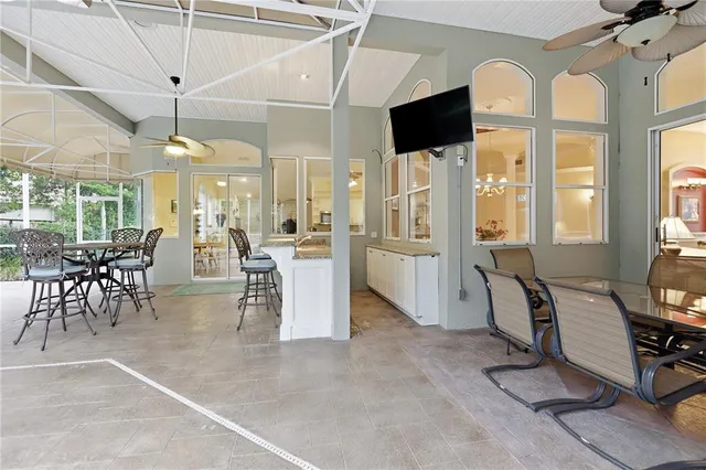 a view of a dining room with furniture window and outside view