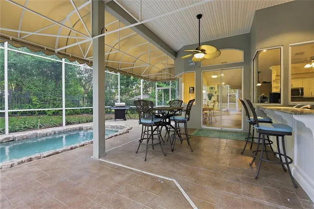 a view of a dining room with furniture window and outside view