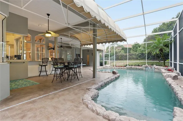 a view of a swimming pool with a patio