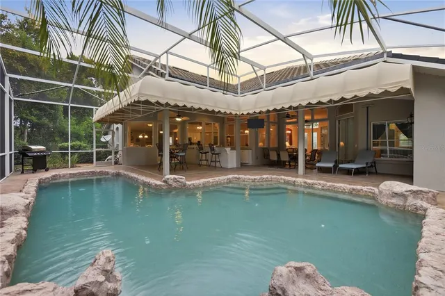 a view of a swimming pool with a patio