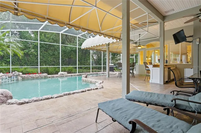 a view of backyard with seating area and furniture