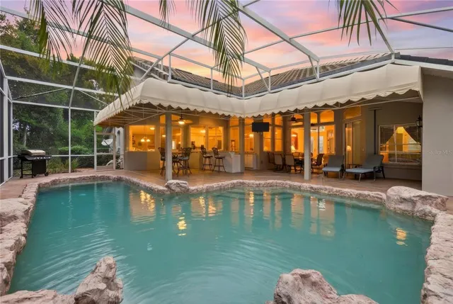 a view of a swimming pool with a patio