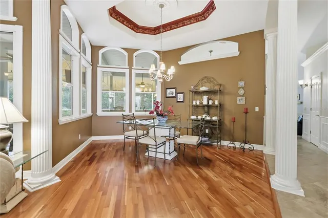 a view of a dining room with furniture and wooden floor